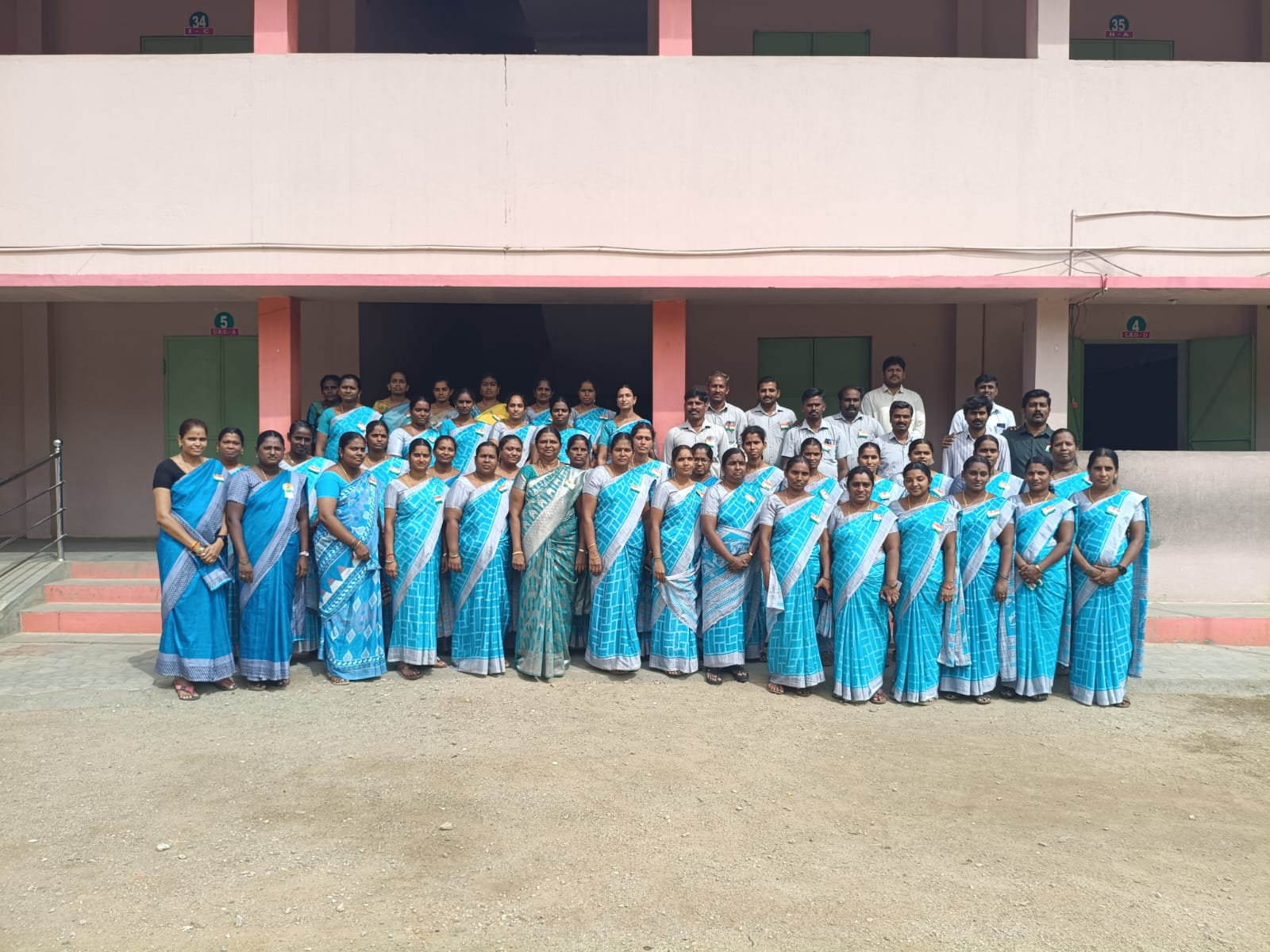 School staff gathered for the Independence Day celebration